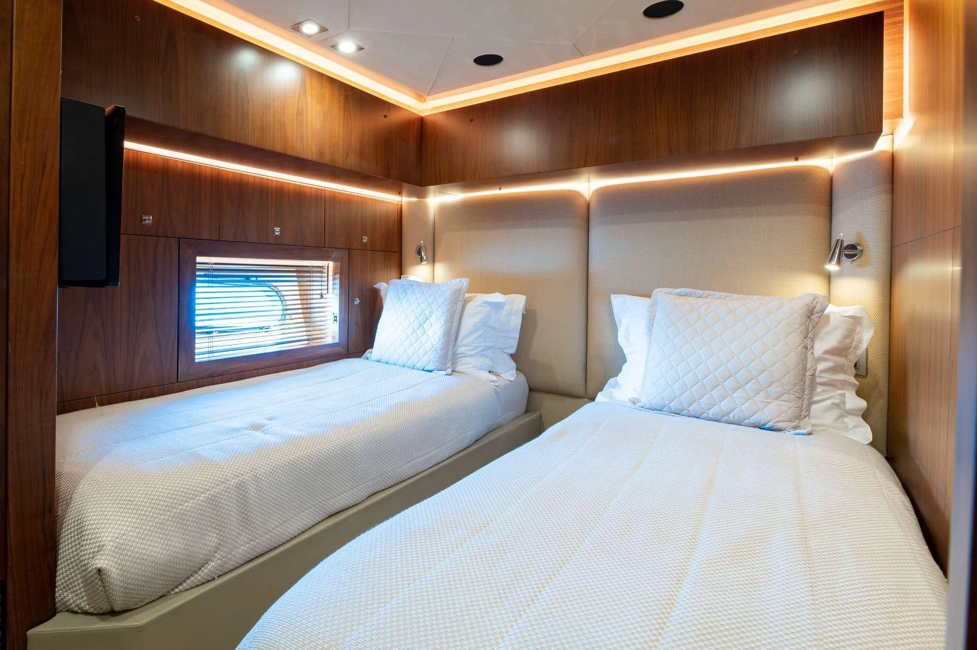 a couple of beds in a room aboard BLADE 6 Yacht for Charter