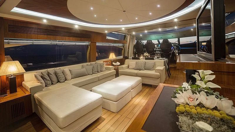 a living room with a large window aboard BLADE 6 Yacht for Charter