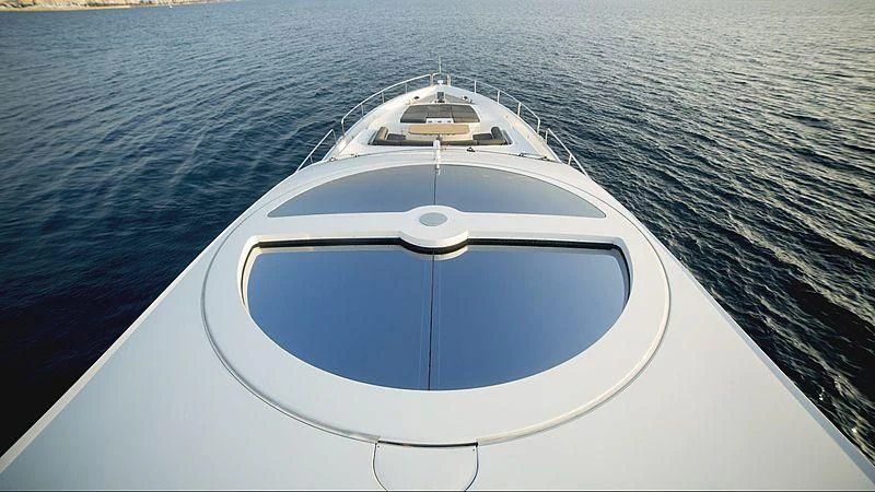 a white boat on a body of water aboard BLADE 6 Yacht for Charter