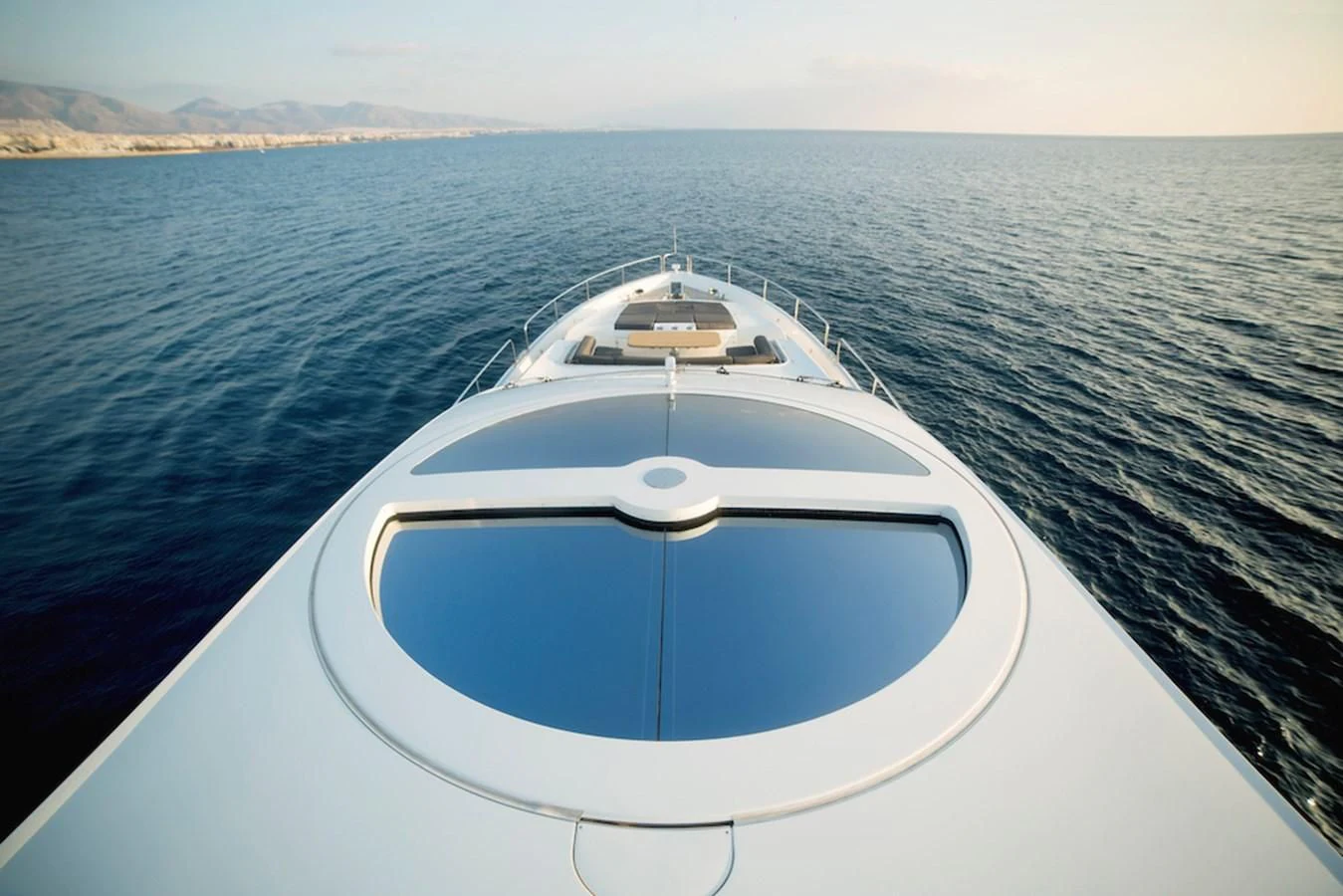 a white boat on water aboard BLADE 6 Yacht for Charter
