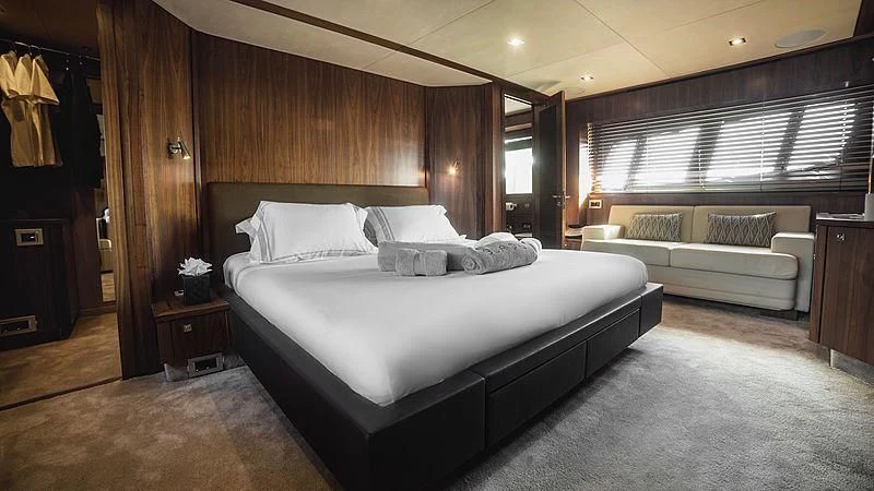 a large bedroom with a large bed aboard BLADE 6 Yacht for Charter