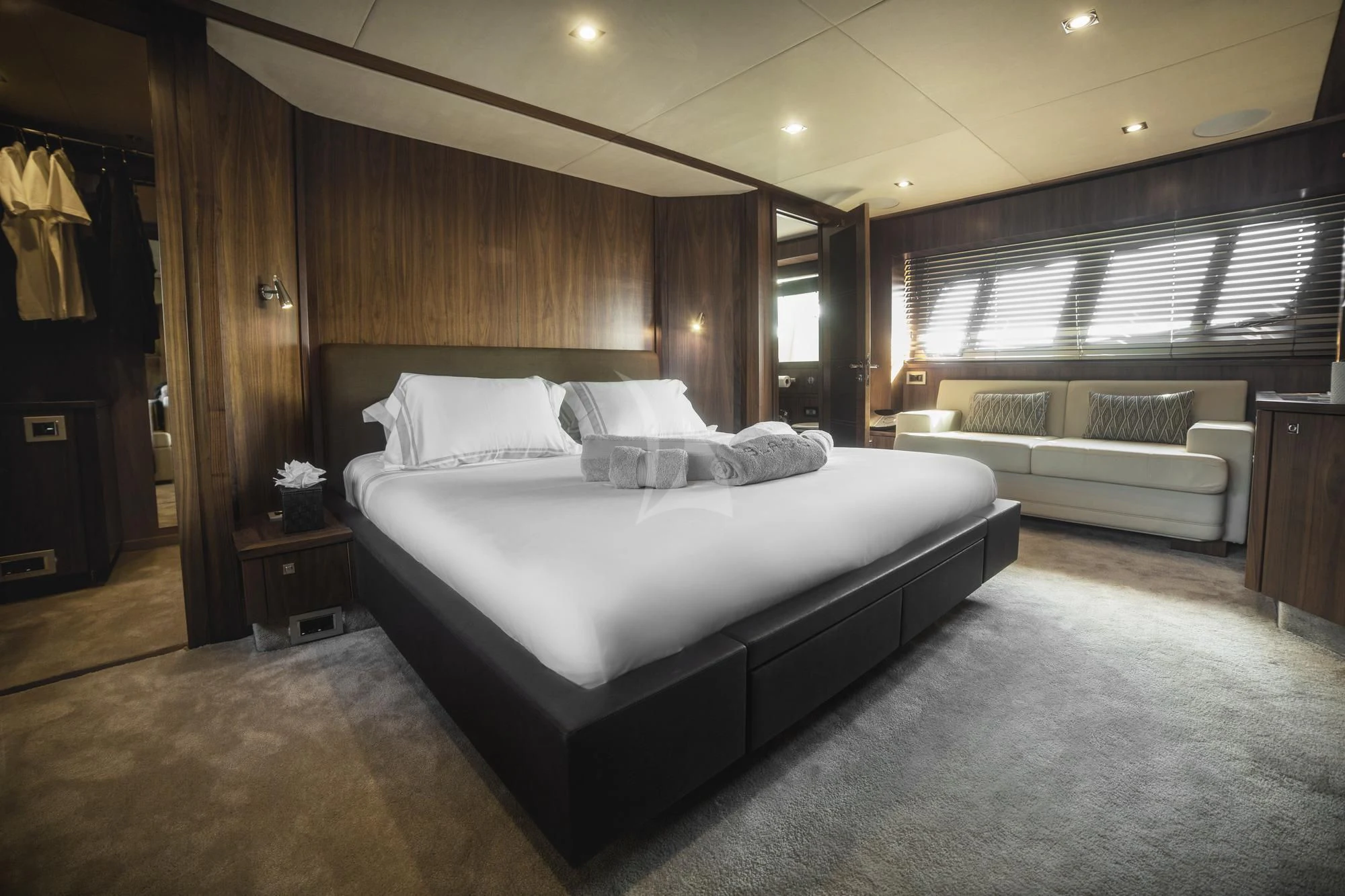 a large bed in a room aboard BLADE 6 Yacht for Charter