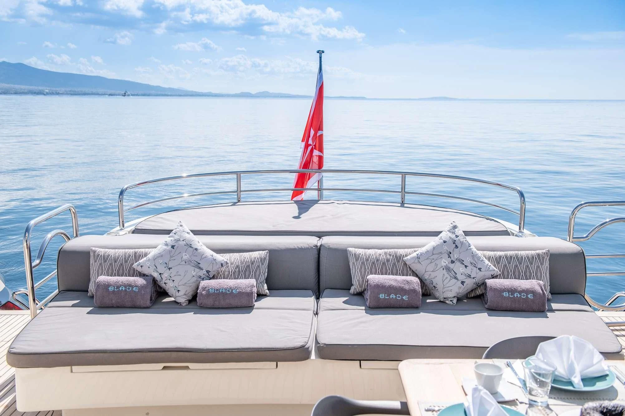 a boat with pillows on it aboard BLADE 6 Yacht for Charter