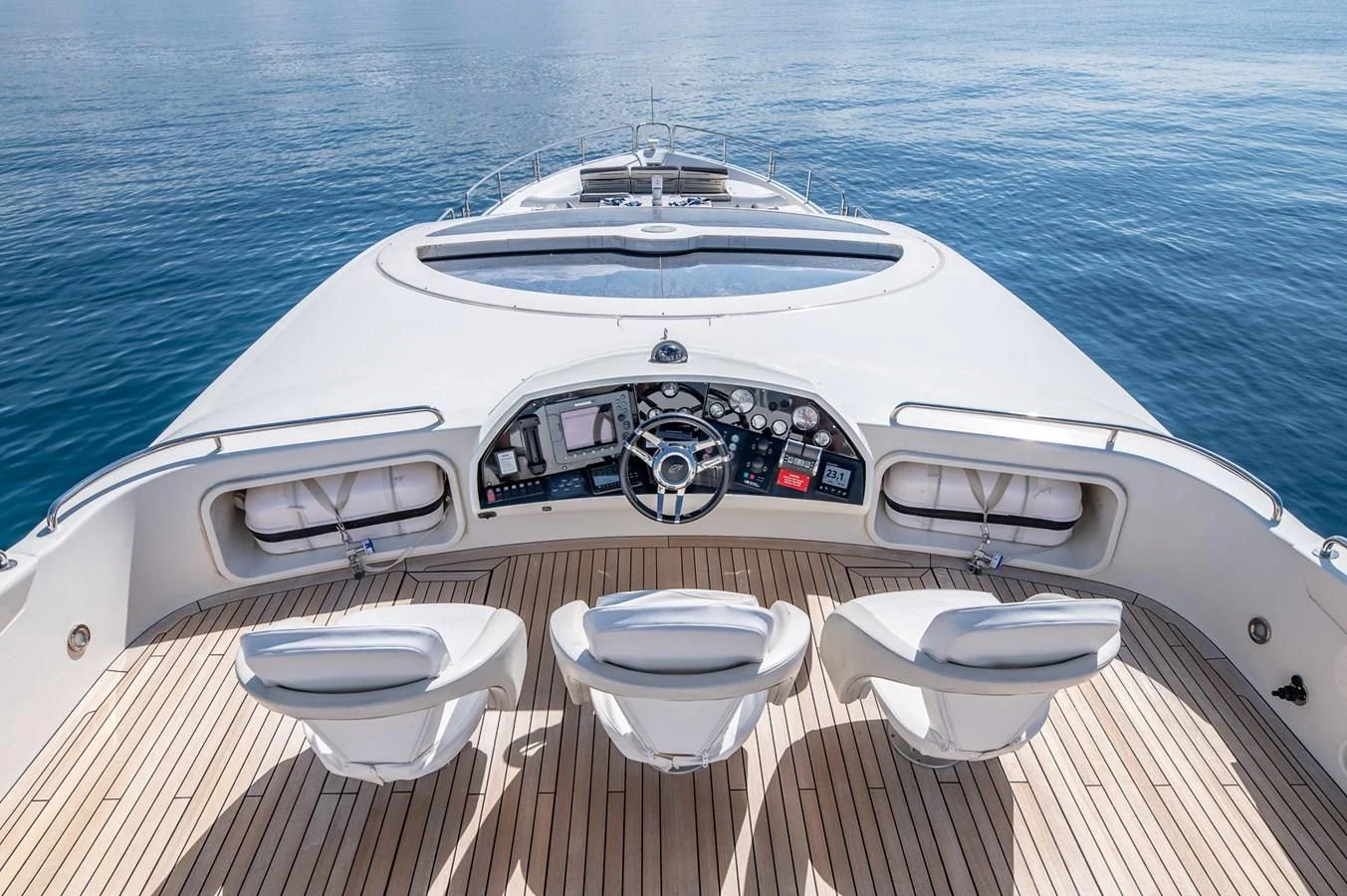 a white boat with a logo on the front aboard BLADE 6 Yacht for Charter