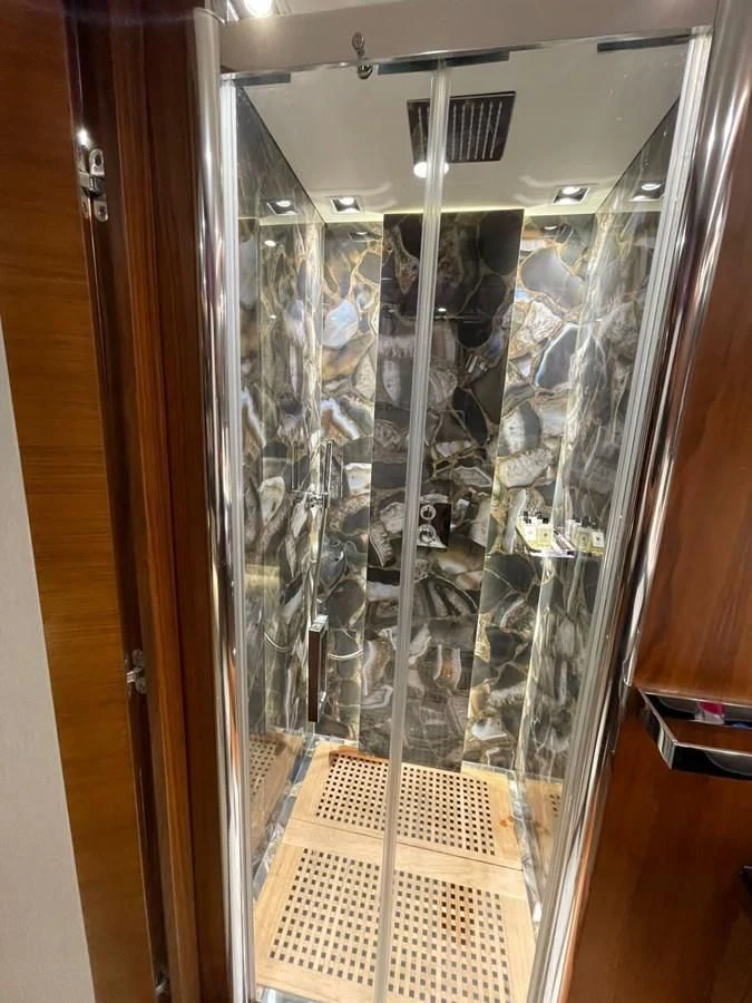 a glass case with a cat inside aboard BLADE 6 Yacht for Charter