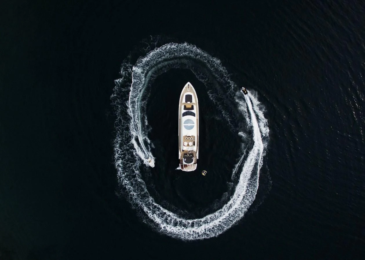 a silver car with a black background aboard BLADE 6 Yacht for Charter