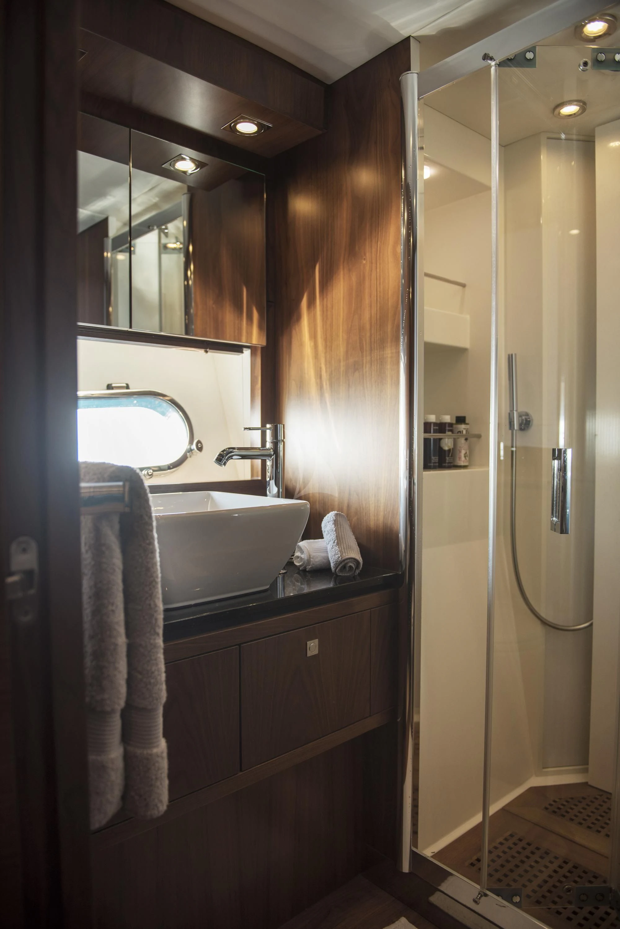 a bathroom with a sink and a mirror aboard BLADE 6 Yacht for Charter
