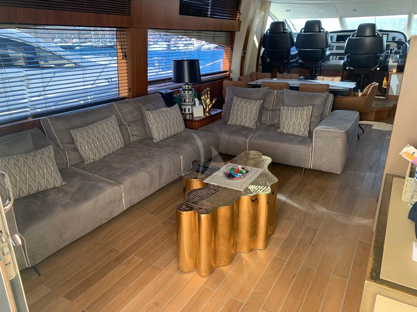 a living room with a couch and a coffee table aboard BLADE 6 Yacht for Charter