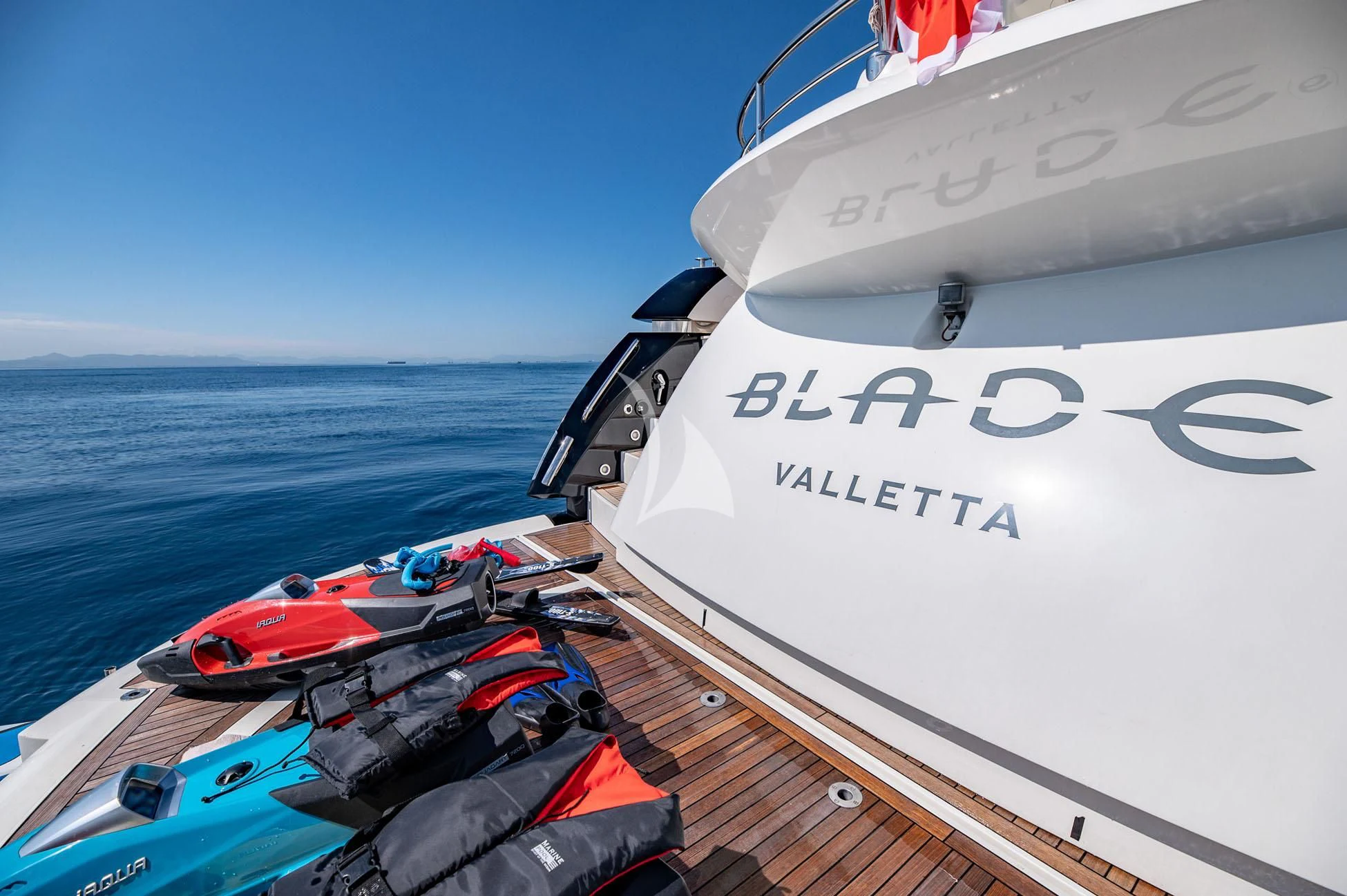 a boat with a motor attached to it aboard BLADE 6 Yacht for Charter