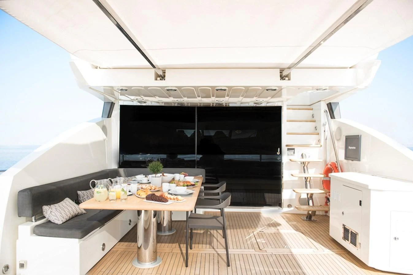 a room with a table and chairs aboard BLADE 6 Yacht for Charter