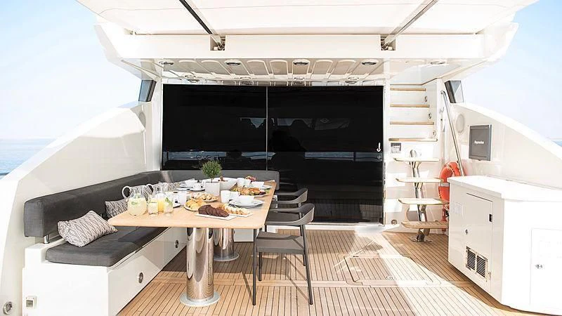 a room with a table and chairs aboard BLADE 6 Yacht for Charter
