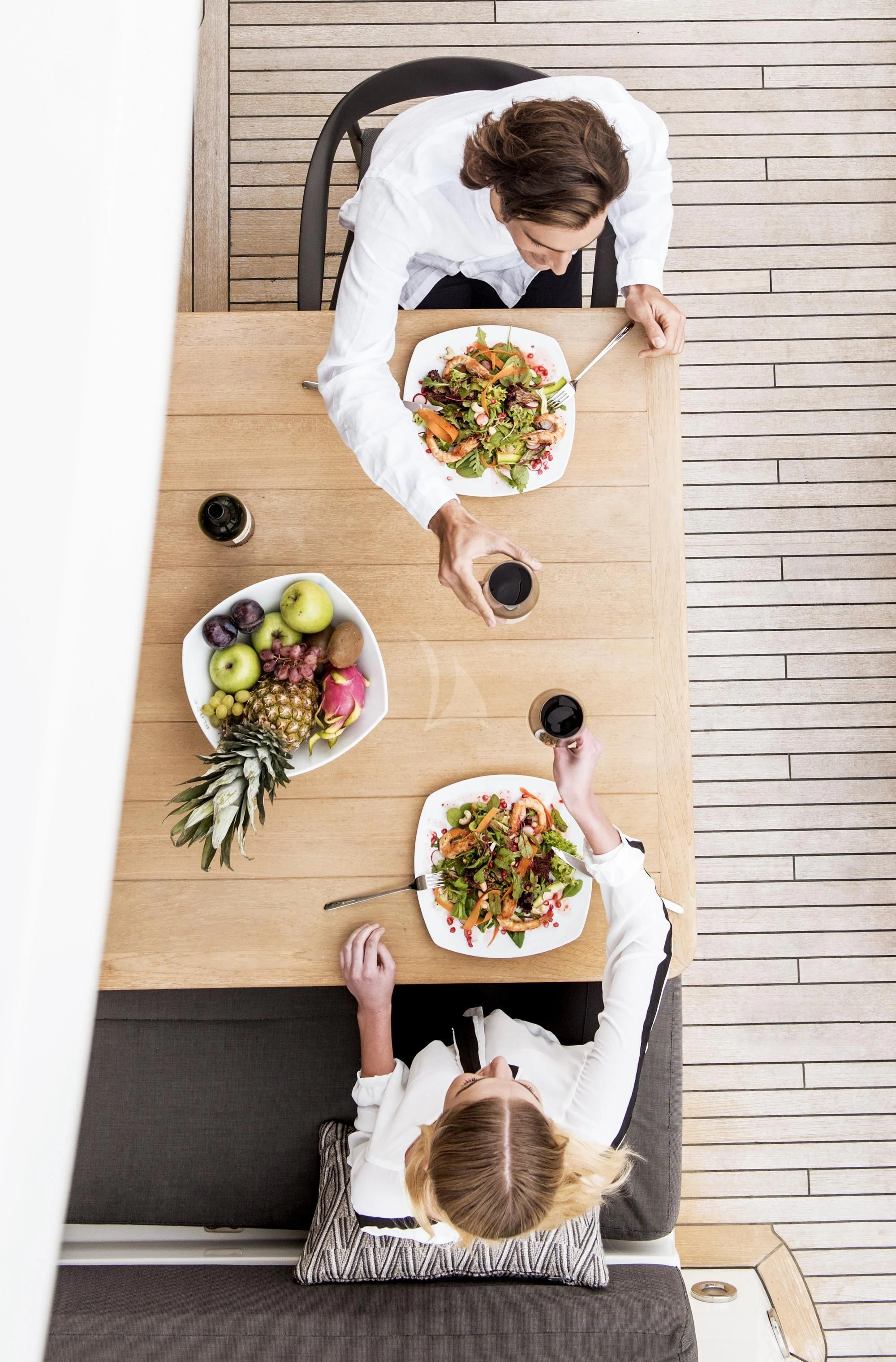 a person cutting a plate of food aboard BLADE 6 Yacht for Charter