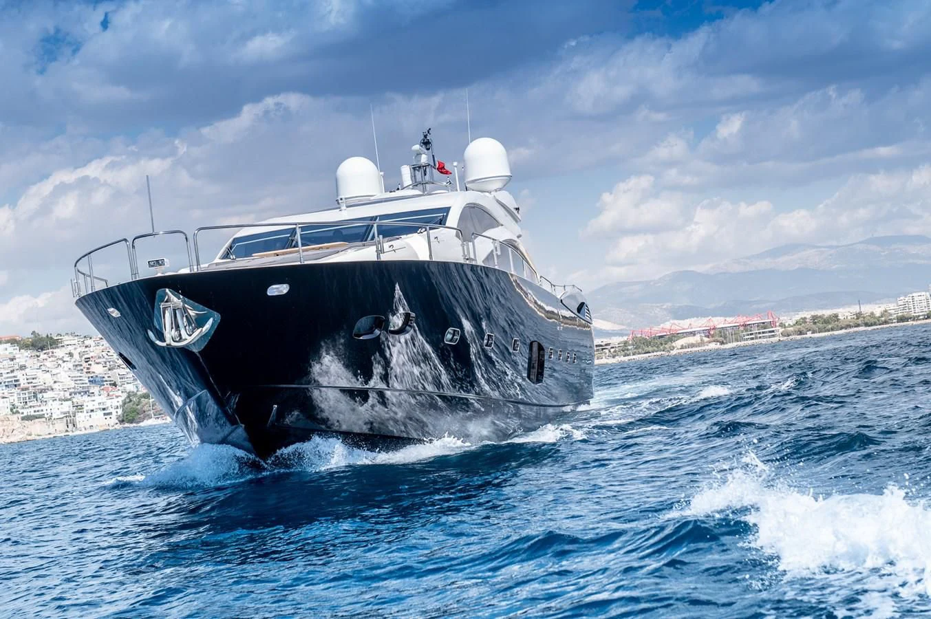 a large ship in the water aboard BLADE 6 Yacht for Charter