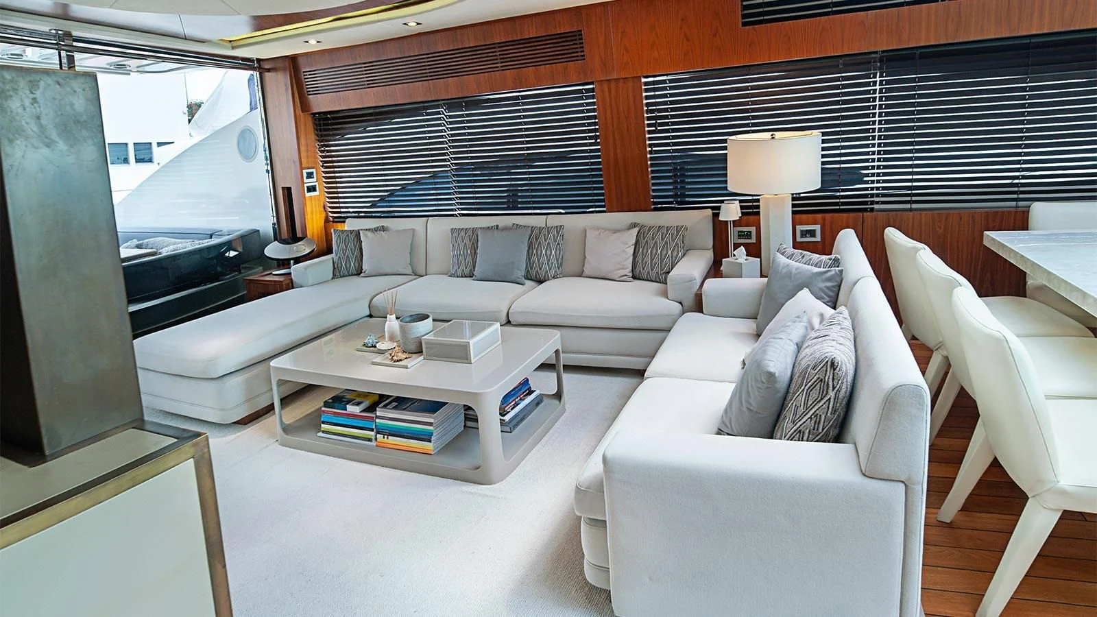 a living room with a couch and a table aboard BLADE 6 Yacht for Charter