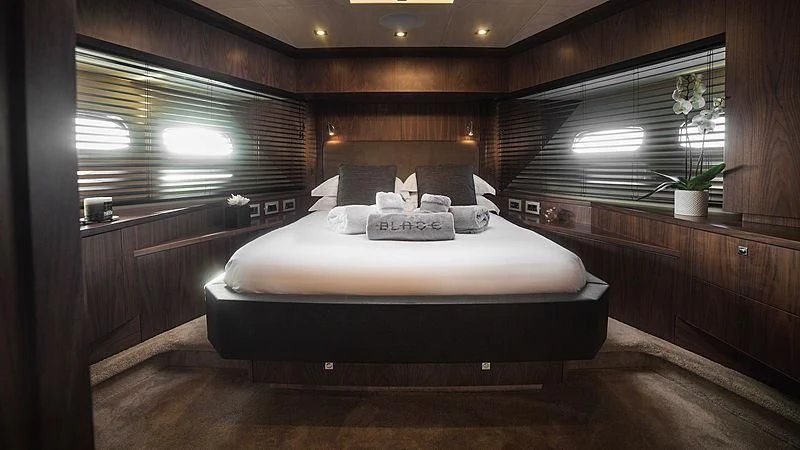 a bed in a room aboard BLADE 6 Yacht for Charter