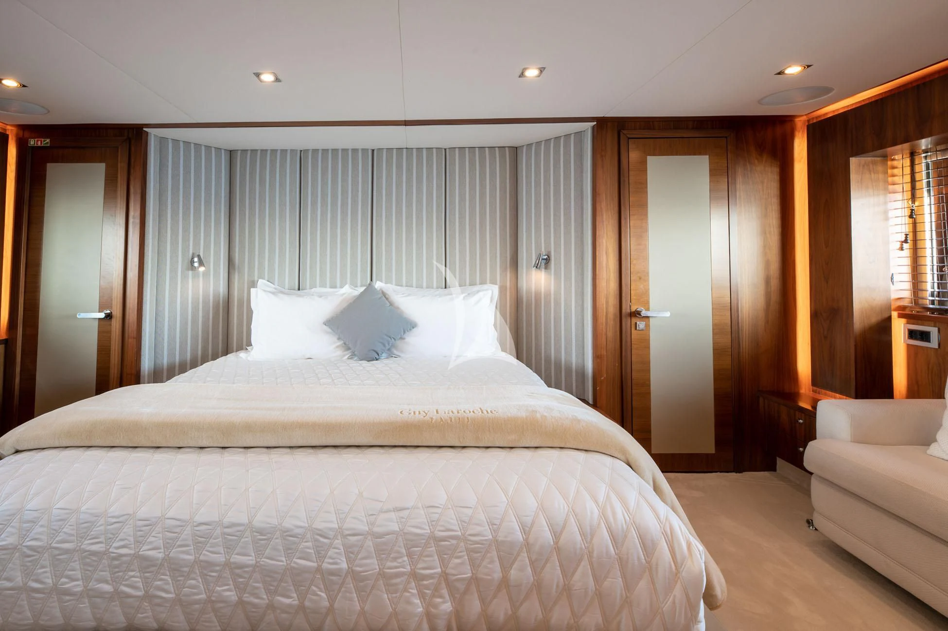 a large bed in a hotel room aboard BLADE 6 Yacht for Charter