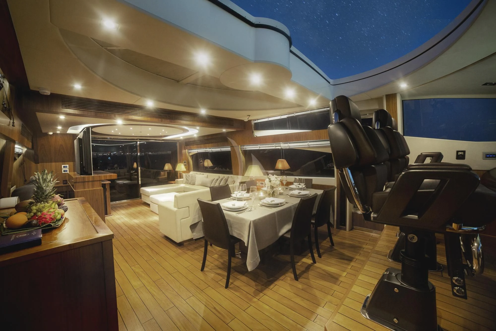 a room with tables and chairs aboard BLADE 6 Yacht for Charter