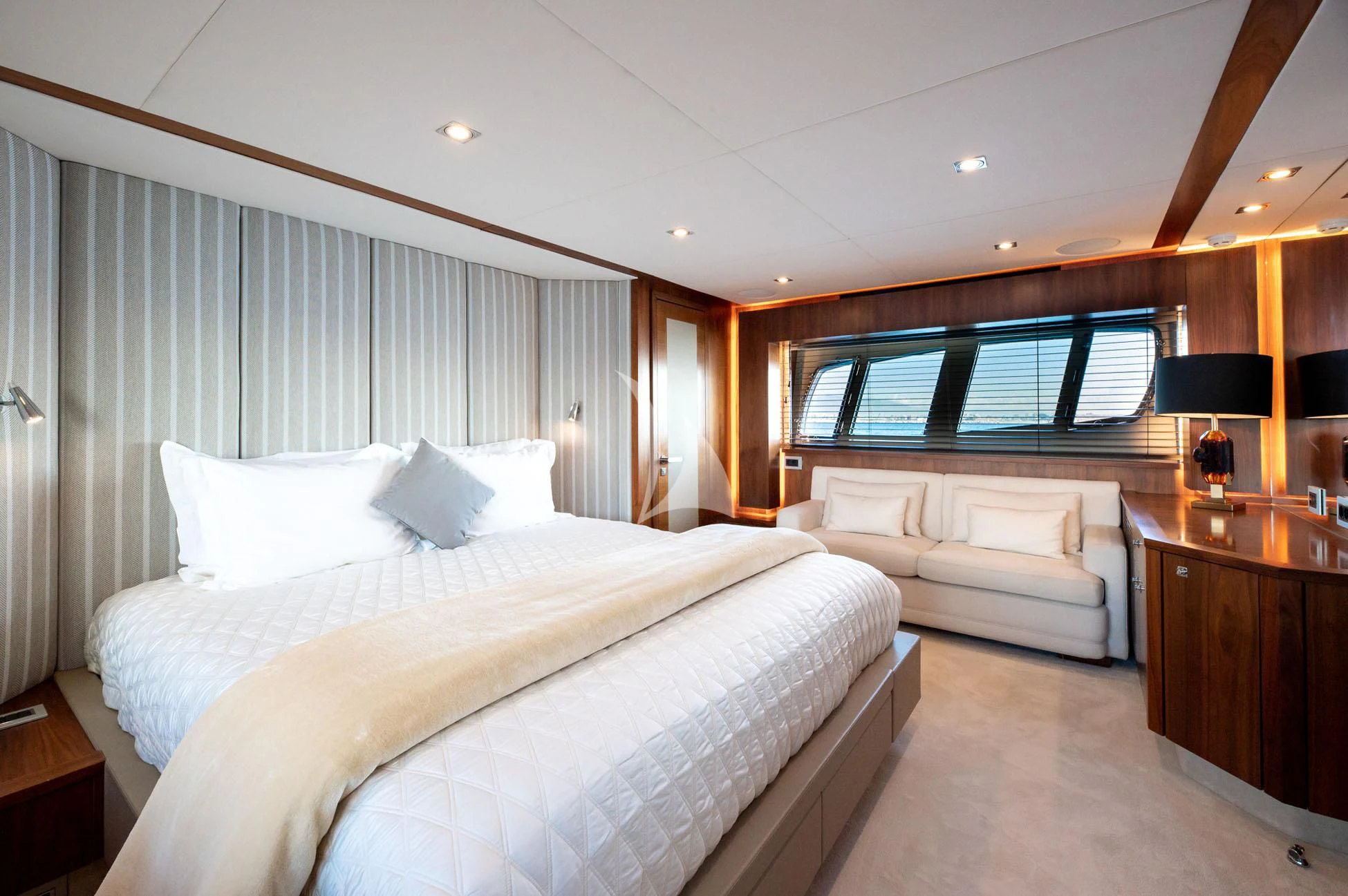 a room with a bed and a window aboard BLADE 6 Yacht for Charter