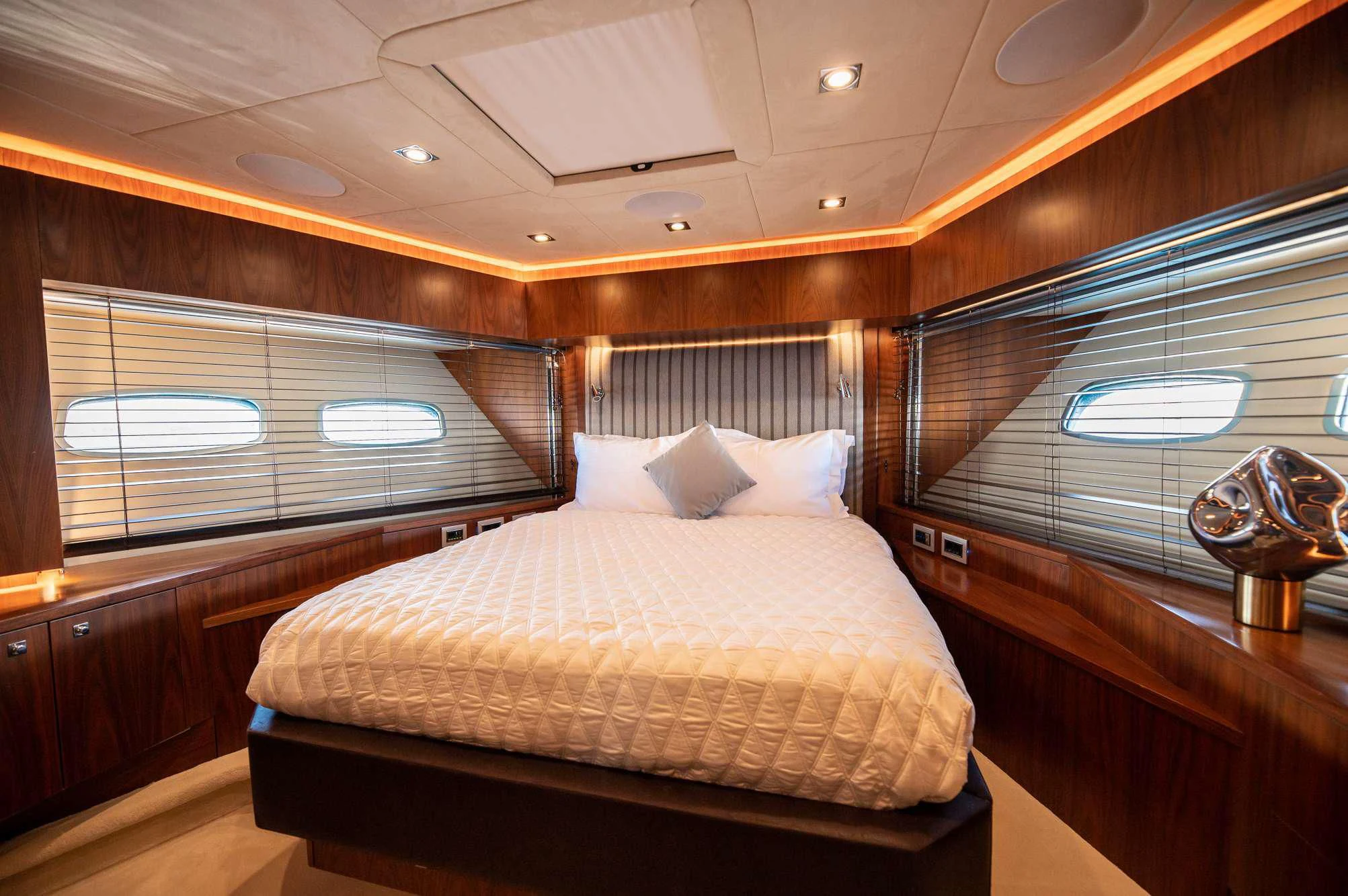 a bed in a room aboard BLADE 6 Yacht for Charter