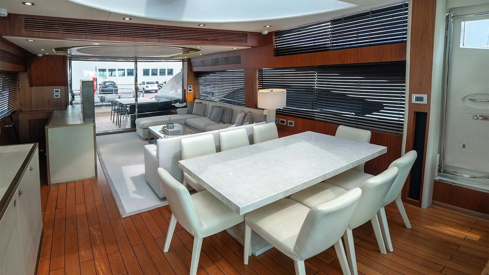 a large room with a table and chairs aboard BLADE 6 Yacht for Charter