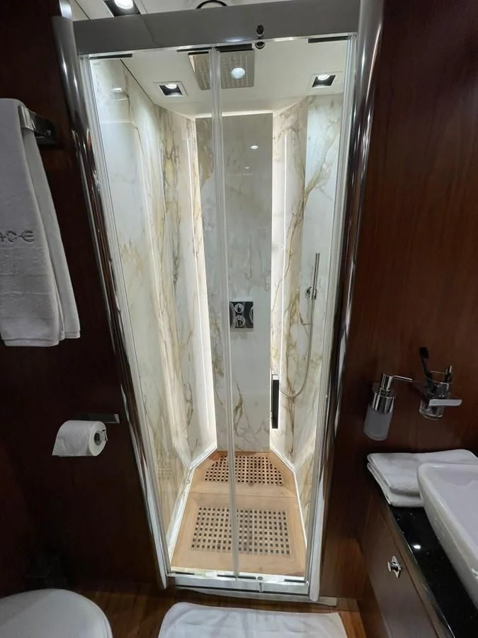 a shower with a glass door aboard BLADE 6 Yacht for Charter