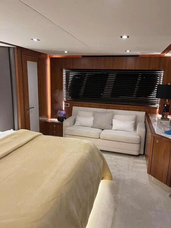 a hotel room with a bed and a desk aboard BLADE 6 Yacht for Charter