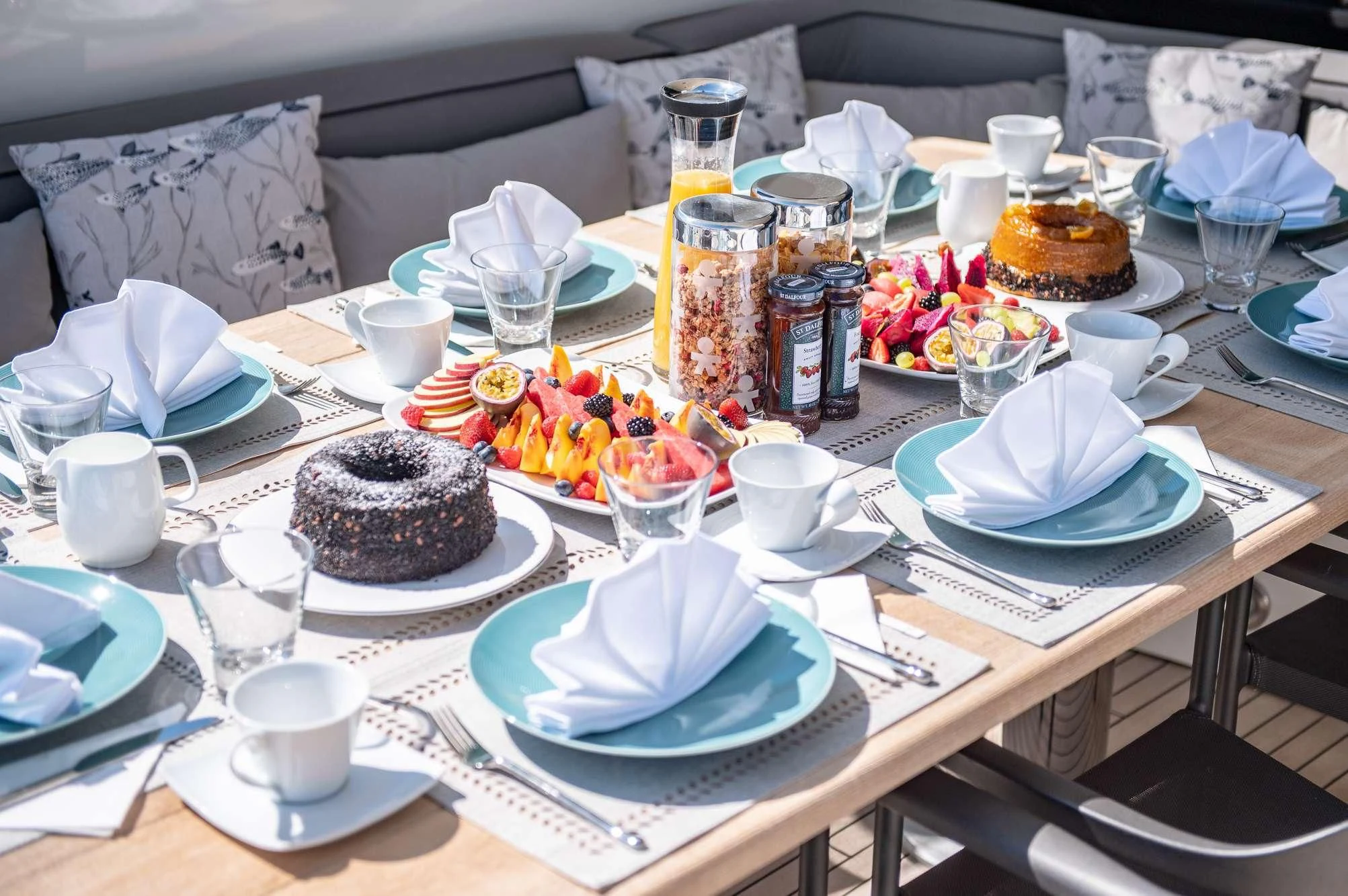 a table with food and drinks aboard BLADE 6 Yacht for Charter
