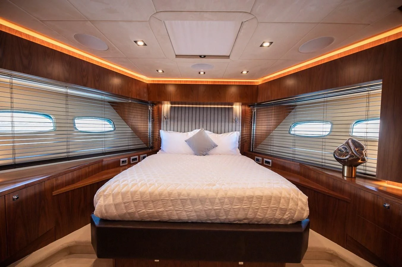 a room with a bed and a window aboard BLADE 6 Yacht for Charter