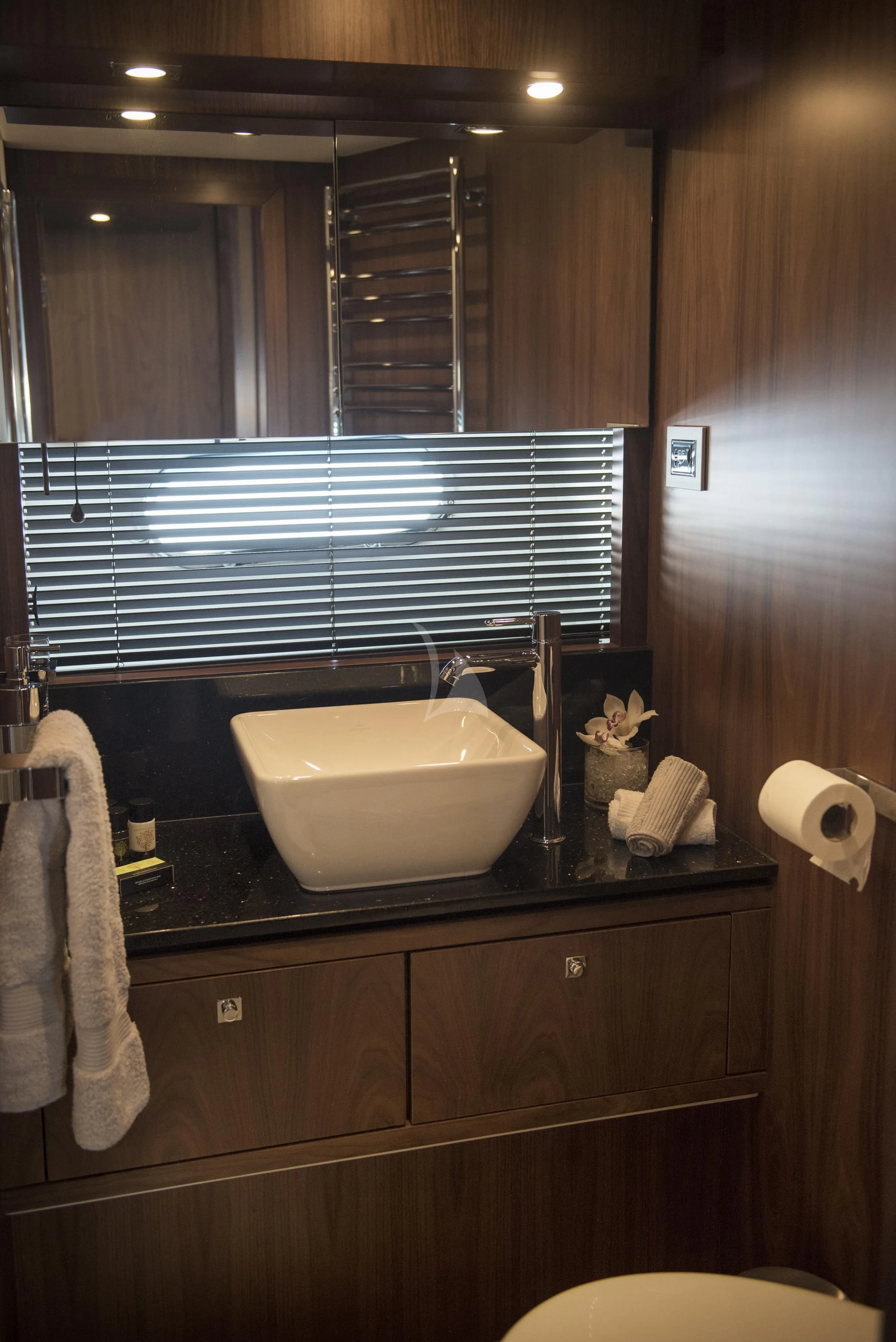 a bathroom with a sink and mirror aboard BLADE 6 Yacht for Charter