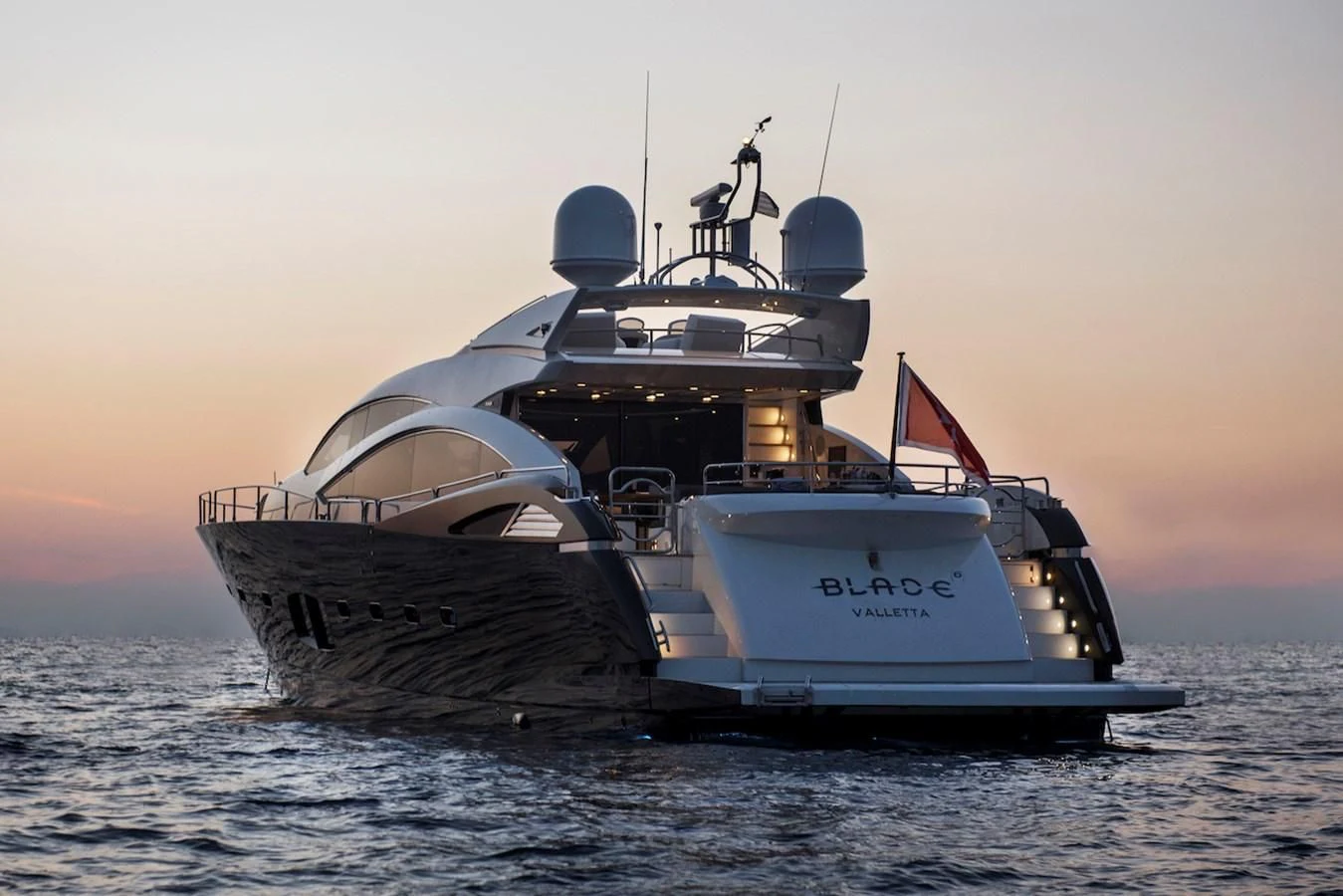 a large ship in the water aboard BLADE 6 Yacht for Charter
