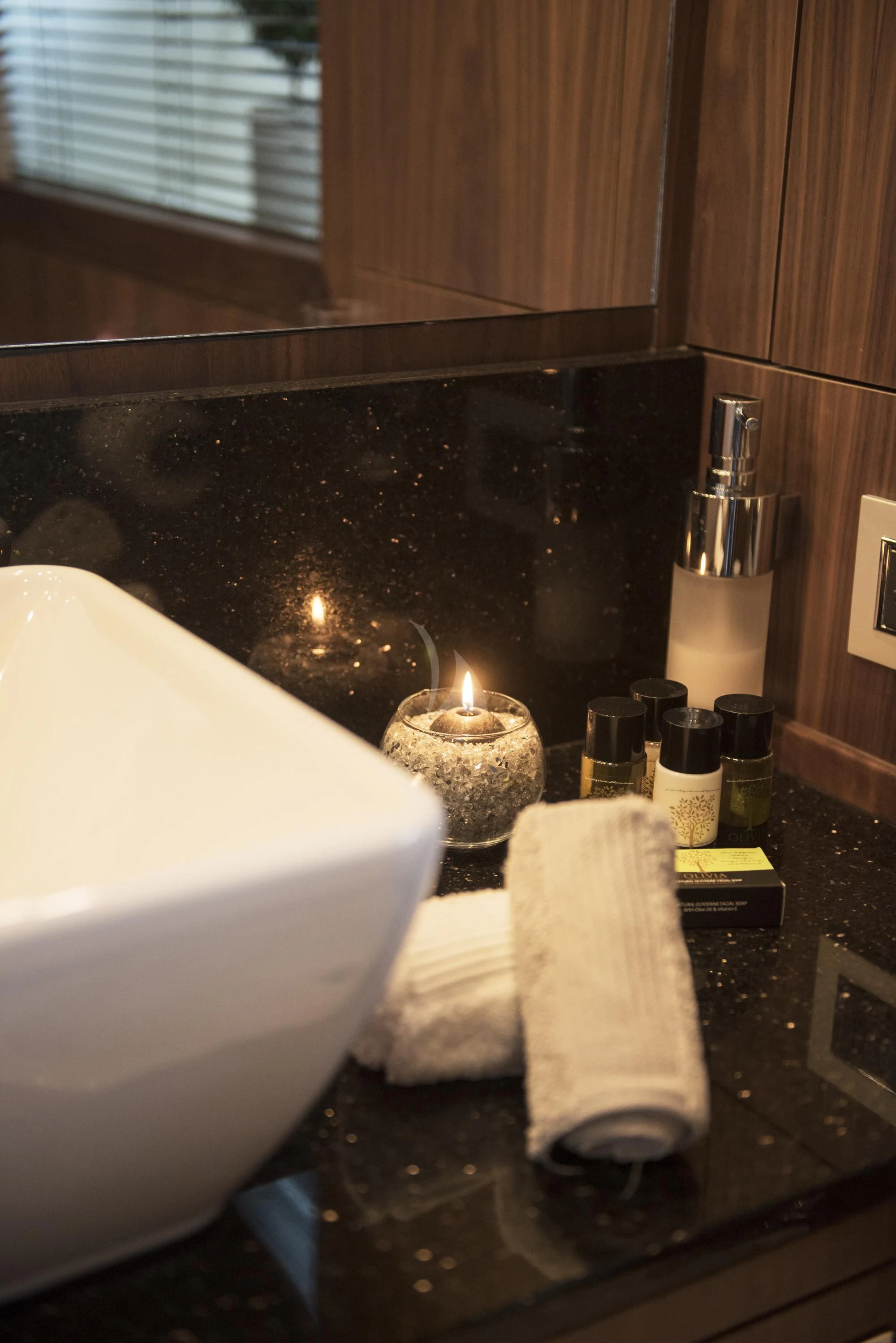 a candle on a counter aboard BLADE 6 Yacht for Charter