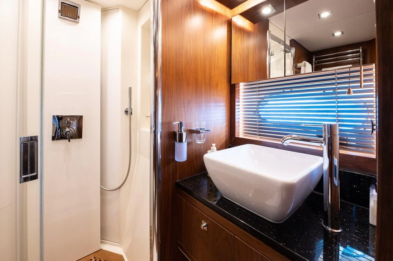 a bathroom with a large bathtub aboard BLADE 6 Yacht for Charter