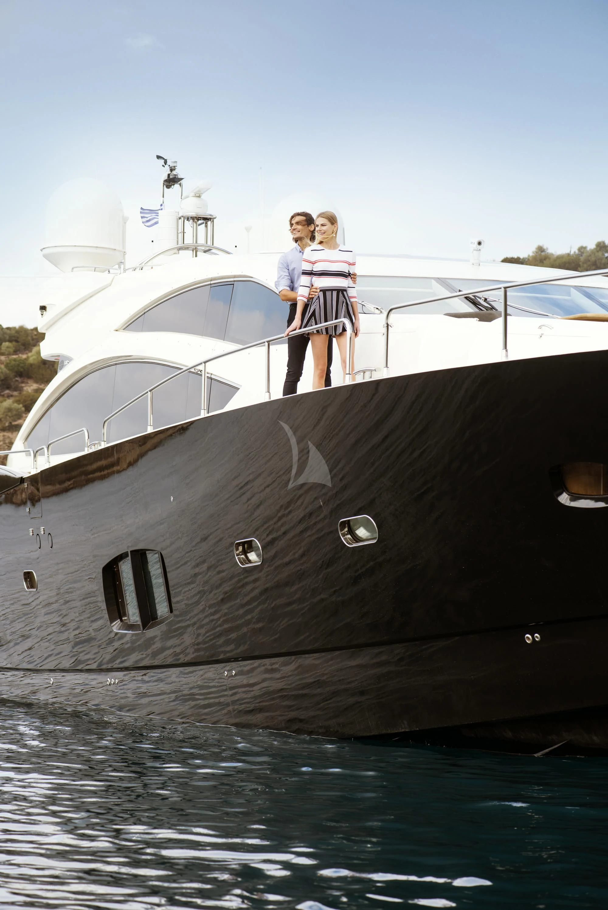 two women standing on a boat aboard BLADE 6 Yacht for Charter