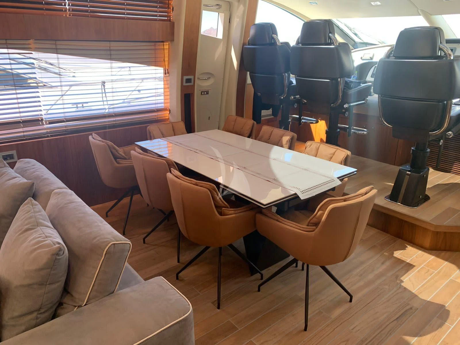 a room with a table and chairs aboard BLADE 6 Yacht for Charter