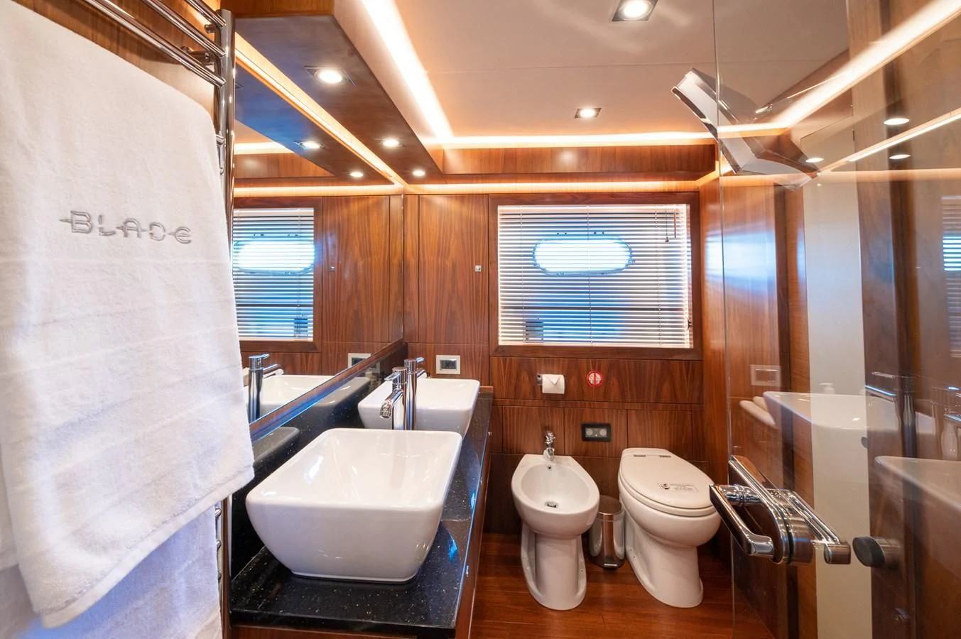a bathroom with a sink toilet and a bathtub aboard BLADE 6 Yacht for Charter