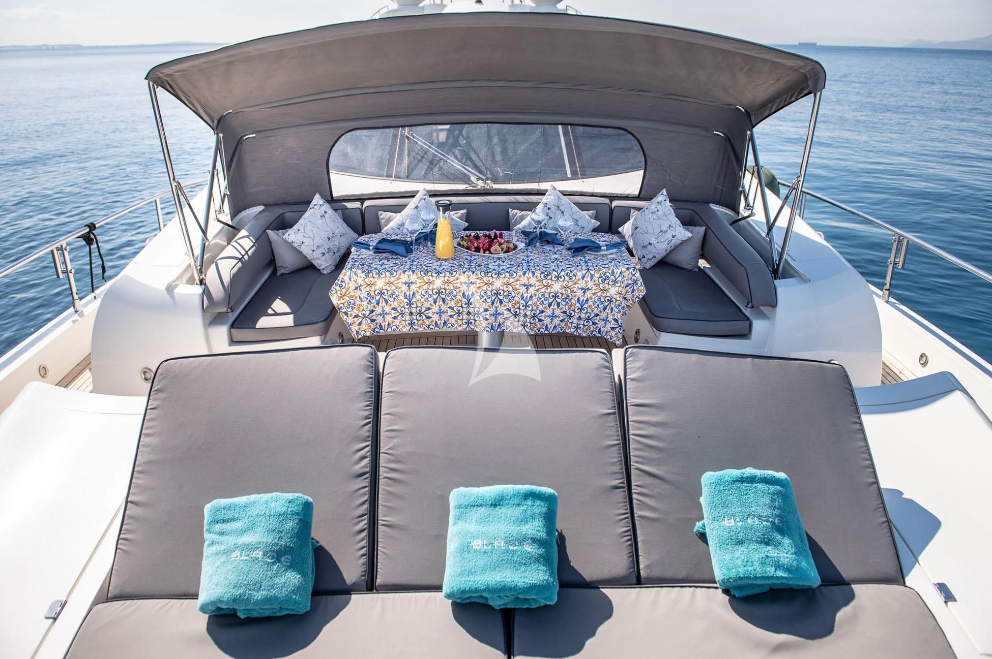 a boat with pillows and pillows aboard BLADE 6 Yacht for Charter