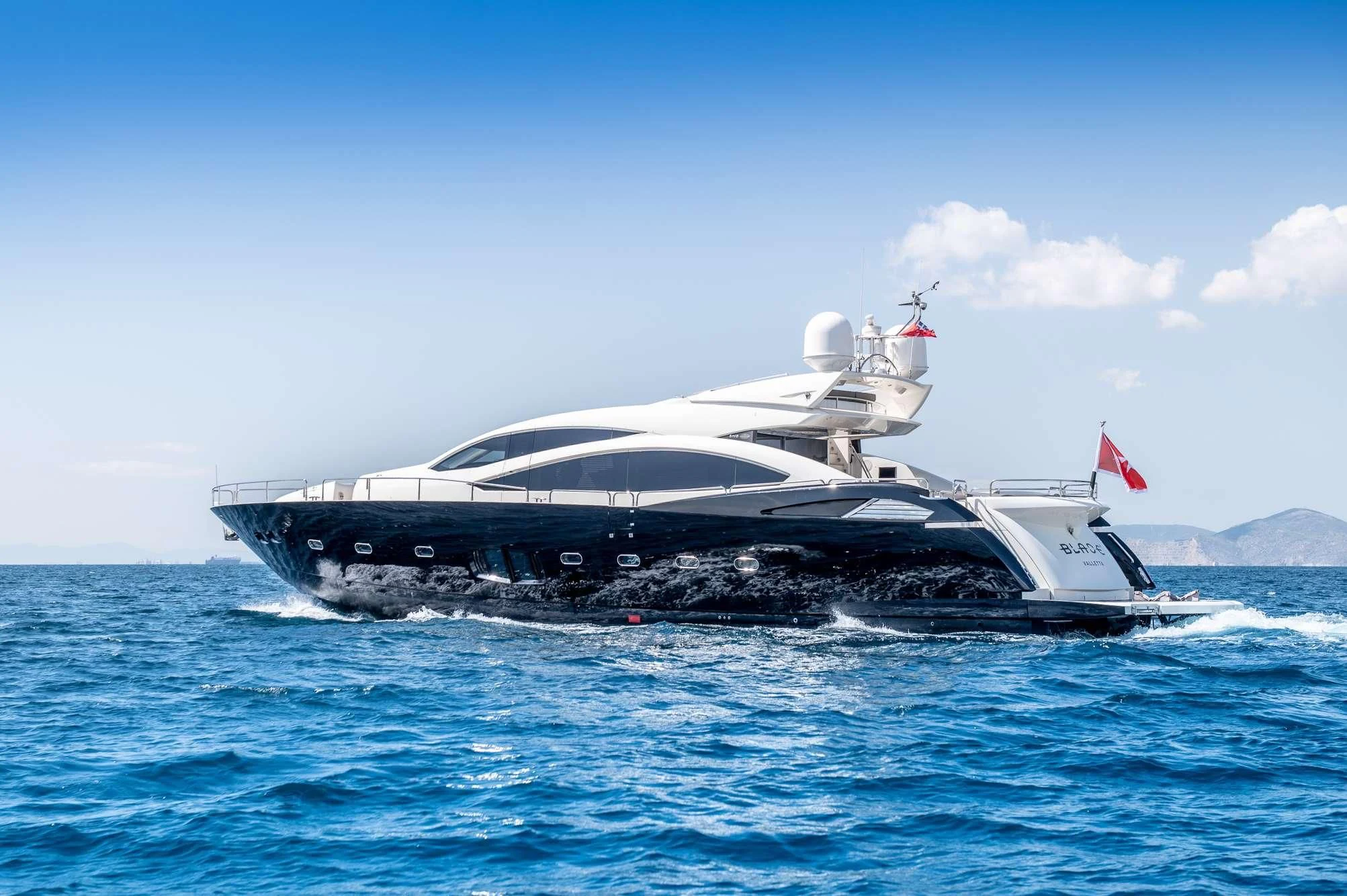 a large boat on the water aboard BLADE 6 Yacht for Charter