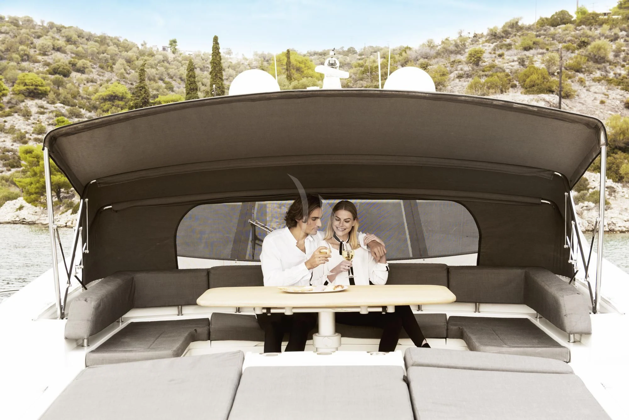 a group of women sitting at a table outside aboard BLADE 6 Yacht for Charter