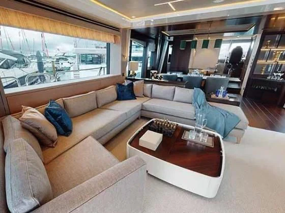 a living room with a large window aboard SUNSEEKER 88/508 Yacht for Sale
