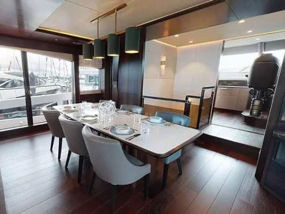 a large dining table in a kitchen aboard SUNSEEKER 88/508 Yacht for Sale