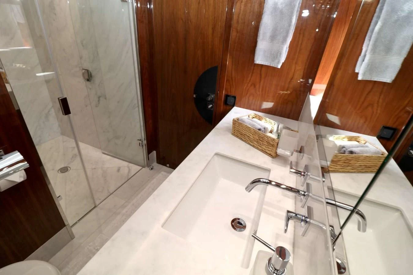 a bathroom with a sink and a mirror aboard SUNSEEKER 86 Yacht for Sale