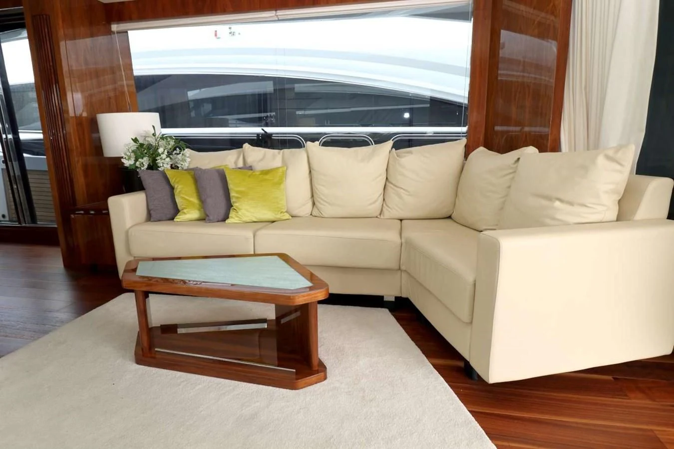 a living room with a couch and a table aboard SUNSEEKER 86 Yacht for Sale