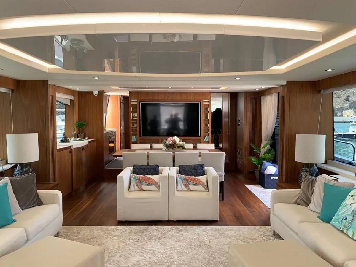 a living room with a large television aboard SUNSEEKER 86 Yacht for Sale