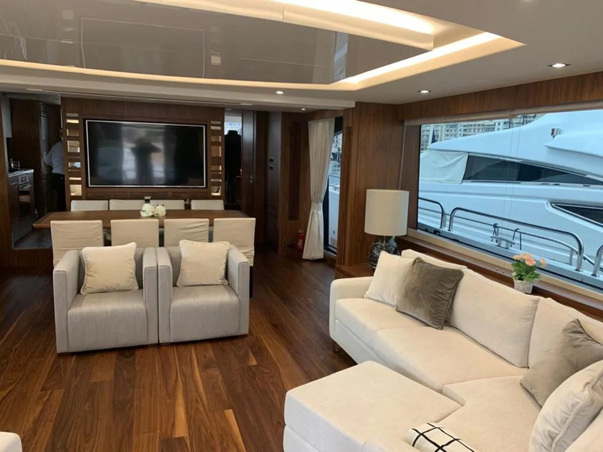 a living room with a large television aboard SUNSEEKER 86 Yacht for Sale
