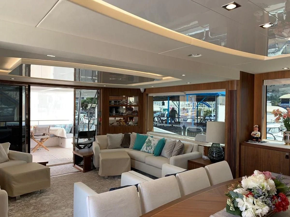 a living room with a large window aboard SUNSEEKER 86 Yacht for Sale
