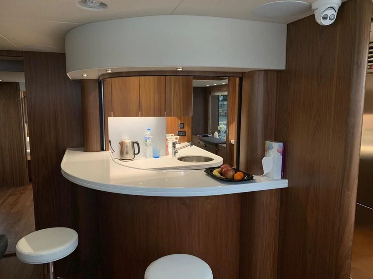 a kitchen with a mirror aboard SUNSEEKER 86 Yacht for Sale