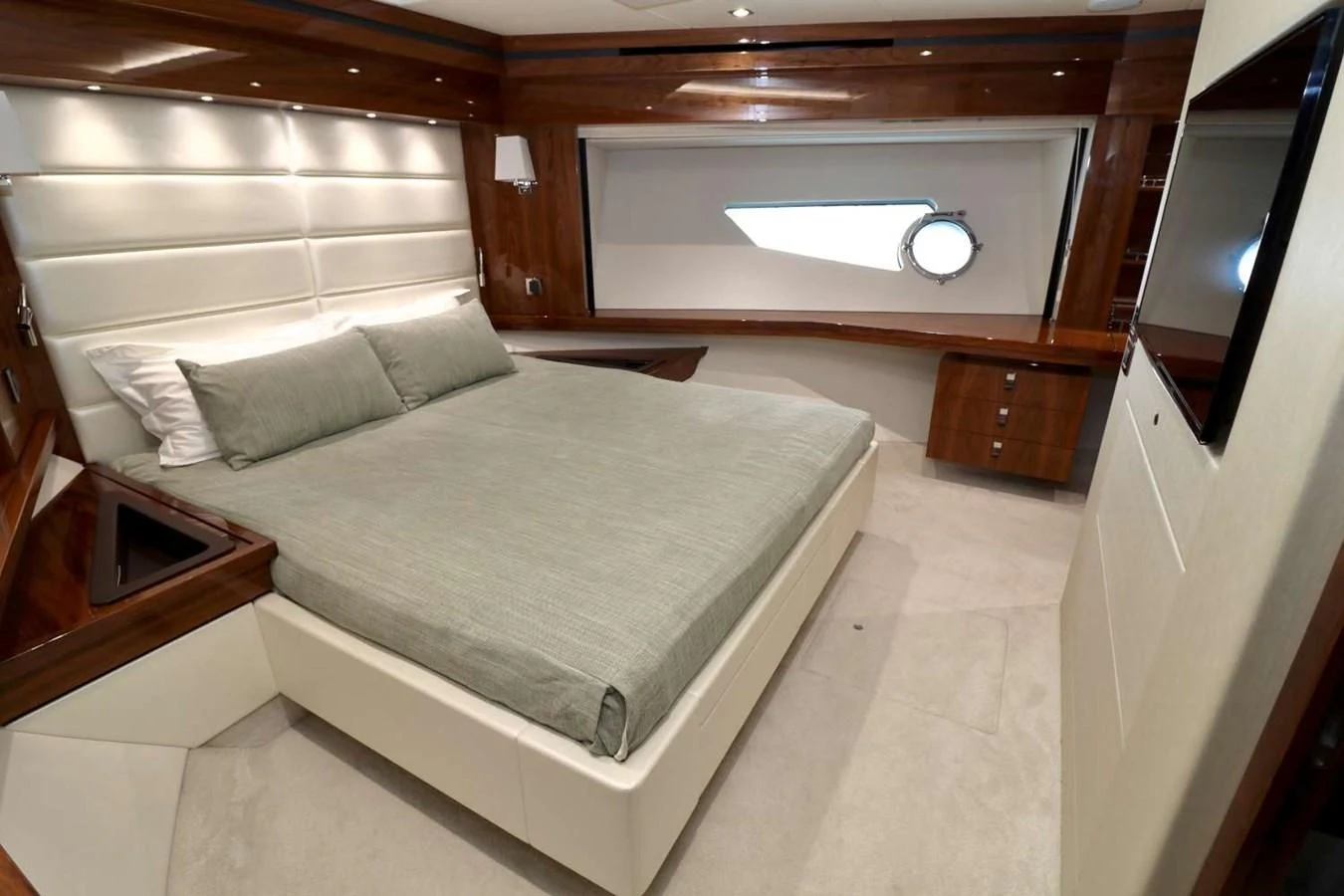a bed in a room aboard SUNSEEKER 86 Yacht for Sale