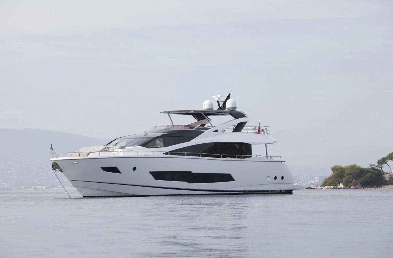 a white yacht on the water aboard SUNSEEKER 86 Yacht for Sale