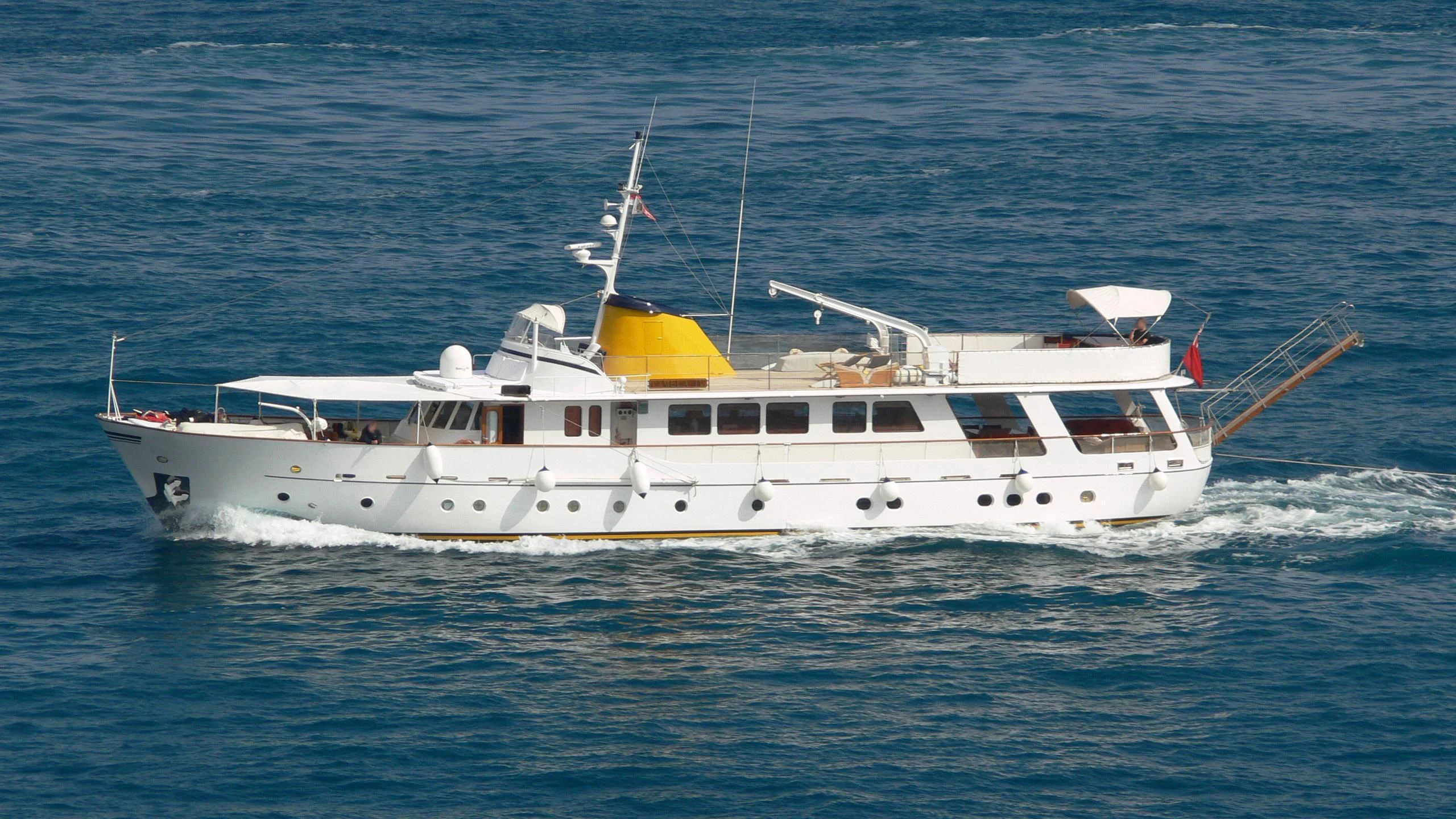 a white boat on the water aboard PAMELA IV Yacht for Sale