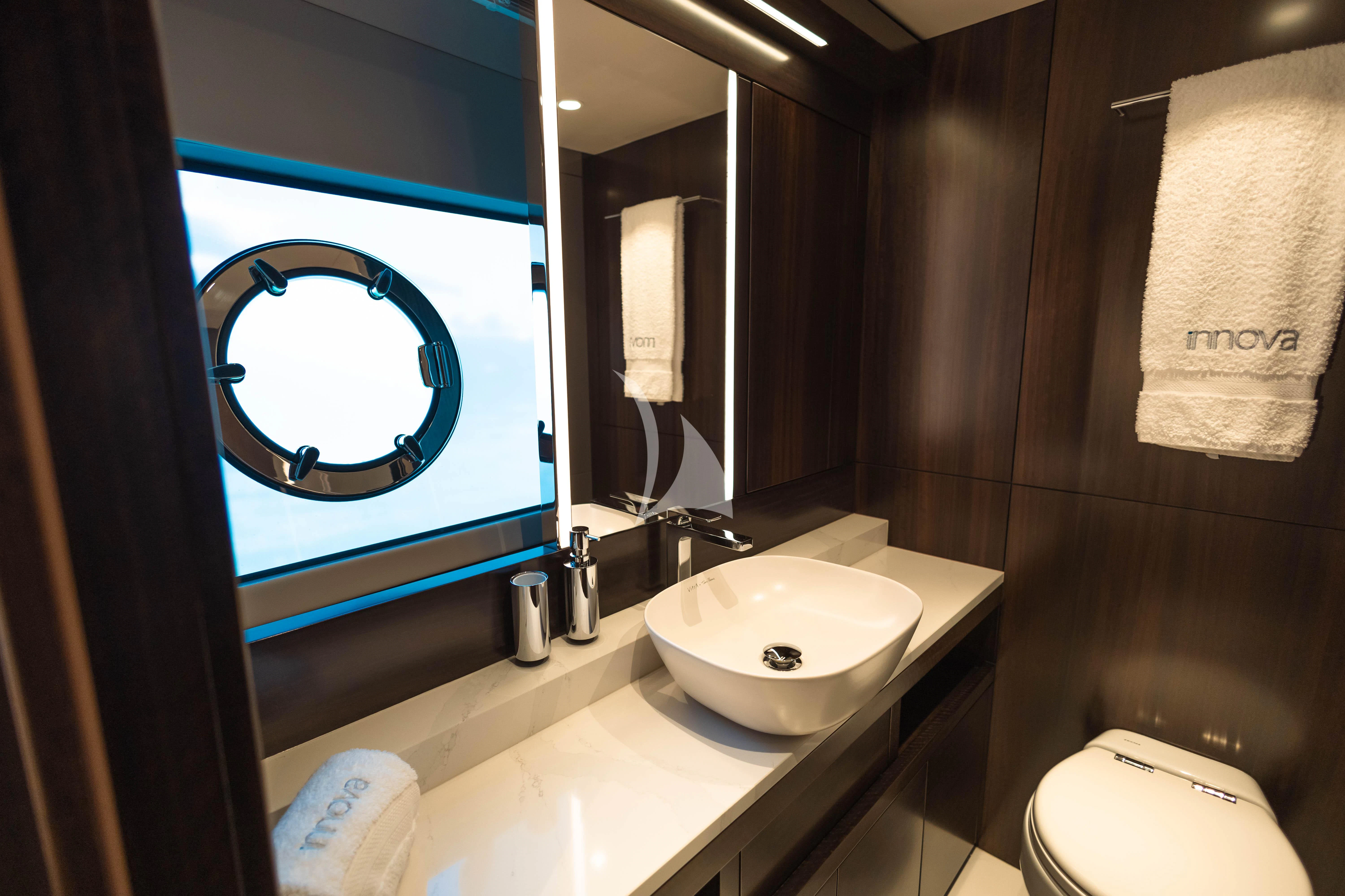 a bathroom with a sink and a mirror aboard MOONLIGHT Yacht for Sale